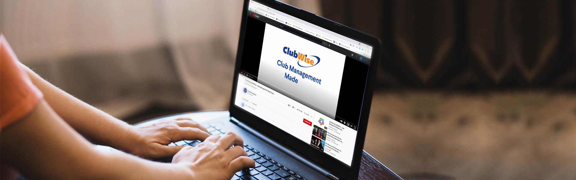 A person watching a ClubWise video on a laptop