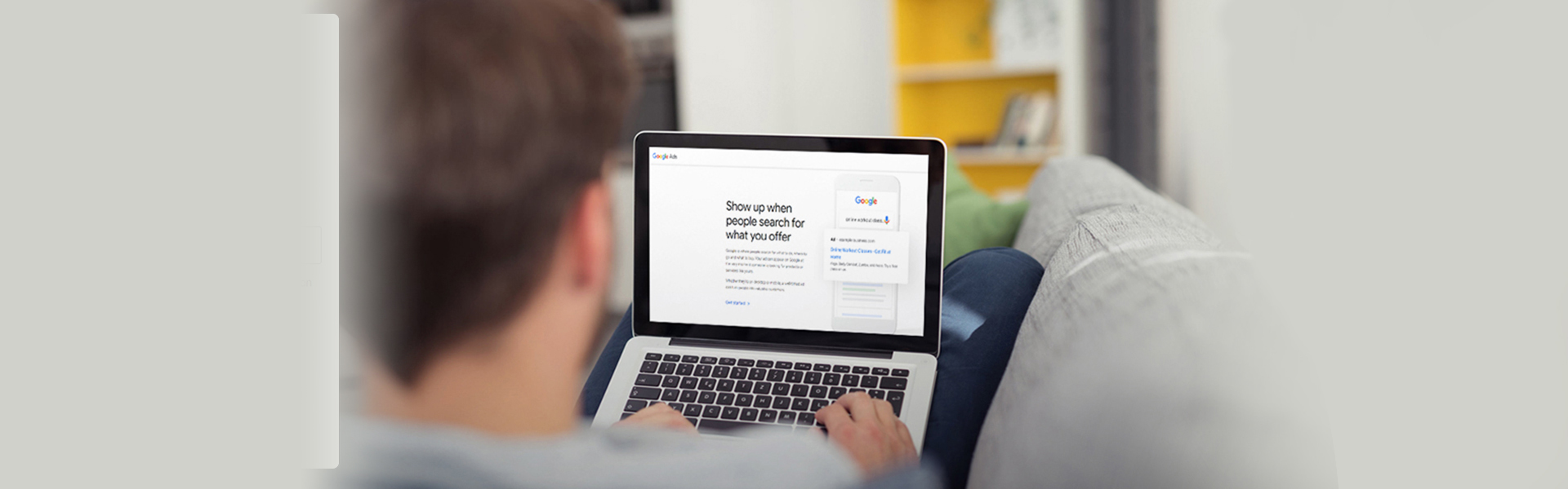 A man using Google Ads on his laptop